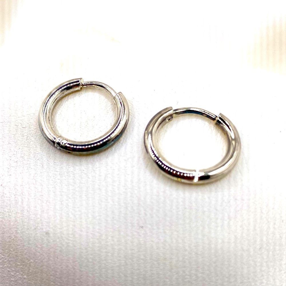 Silver toned dainty small tube hugie hoop earrings